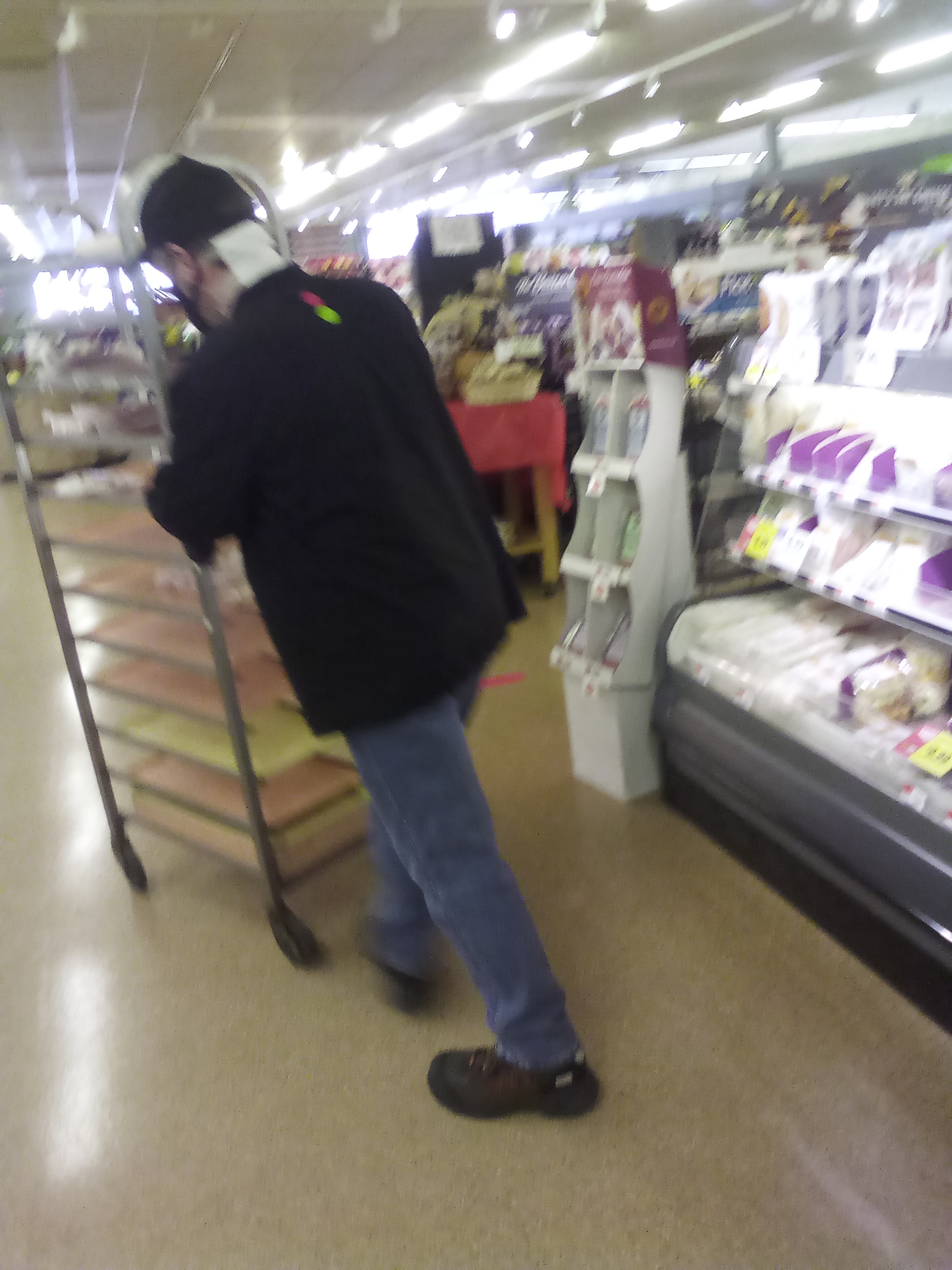 Stop and Shop complaint Employee coughing on food while shelving items.