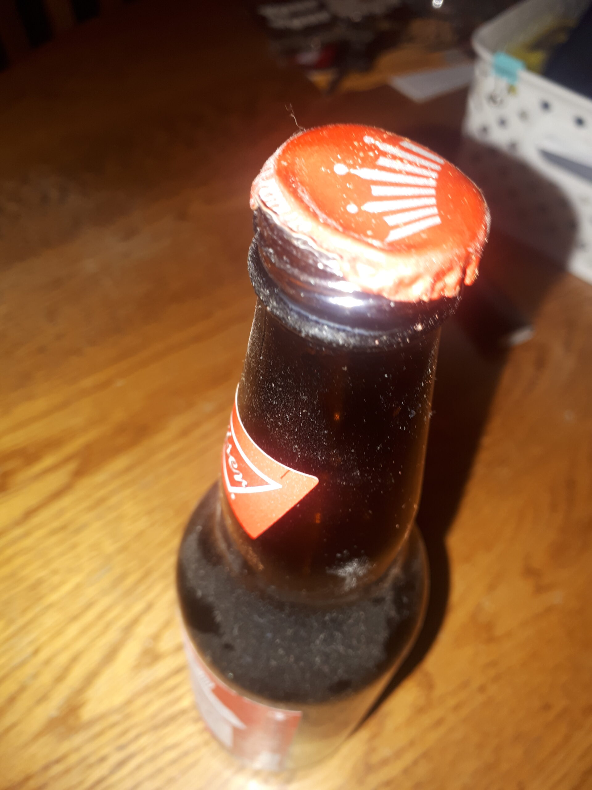 Budweiser complaint miss stamped cap on bottle